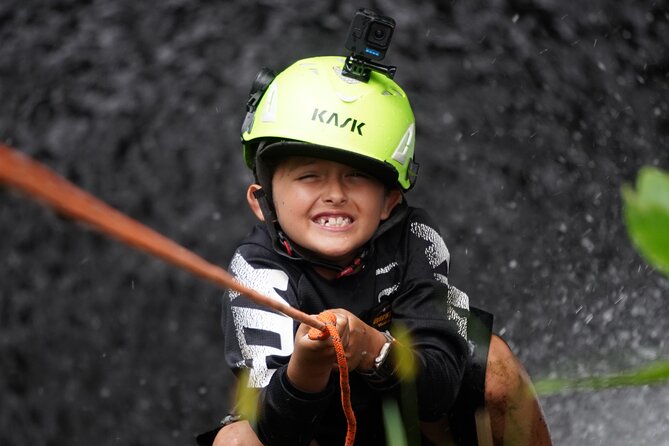 Chasing Waterfalls:Wild Hawaii Rappelling - Rappelling to the waterfall: harness, helmet, and calm coaching