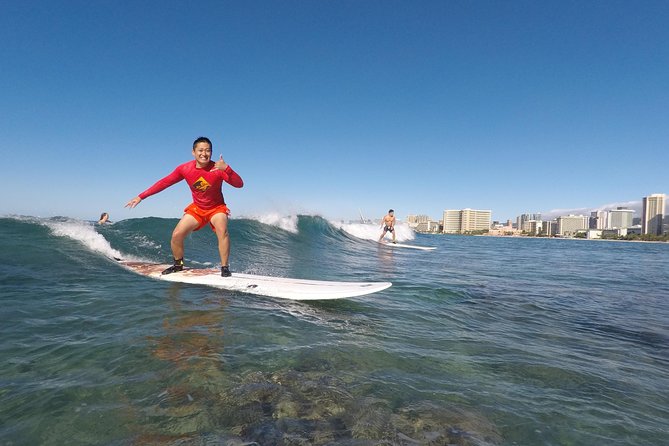 Exclusive Group Surfing Lesson with Waikiki Courtesy Shuttle - From Sand Basics to Leash-On Confidence