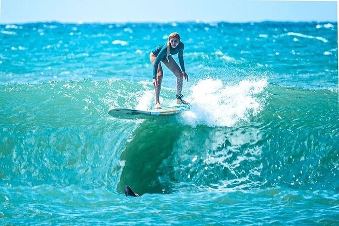 Learn to surf with a local big wave rider on the North Shore of Oahu - 15 to 20 minutes of beach safety and stance that actually matters