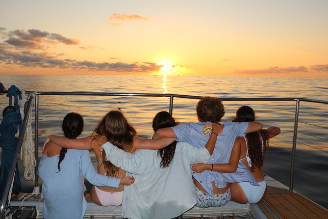 Premium Snorkel Sunset Cruise with Whale and Dolphin Watch - From marina to catamaran: what the ride and group size mean for you